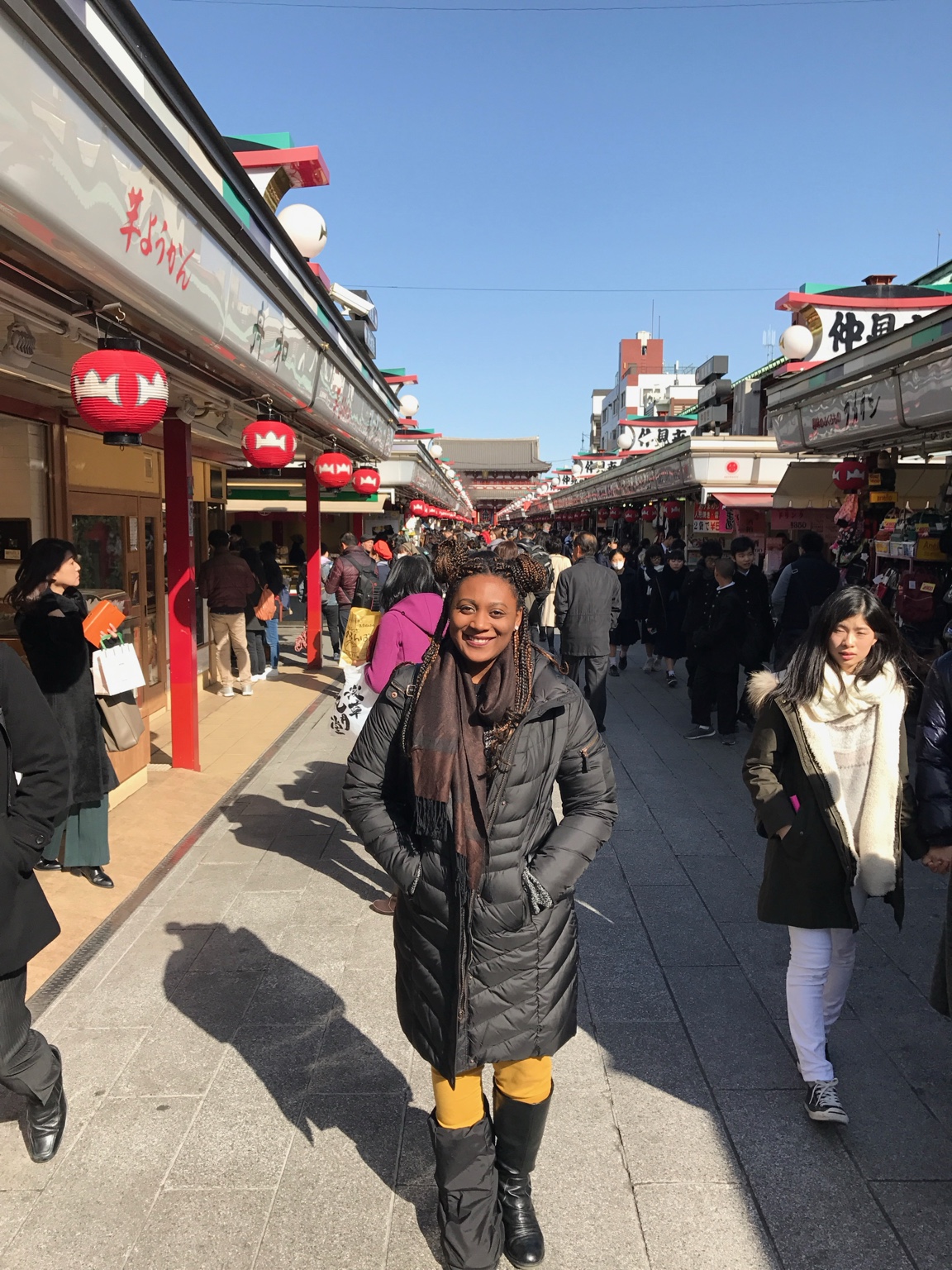 Madoree exploring a market street in Japan